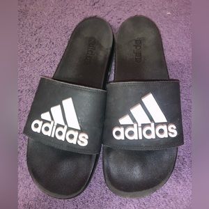 Black and white adidas slides